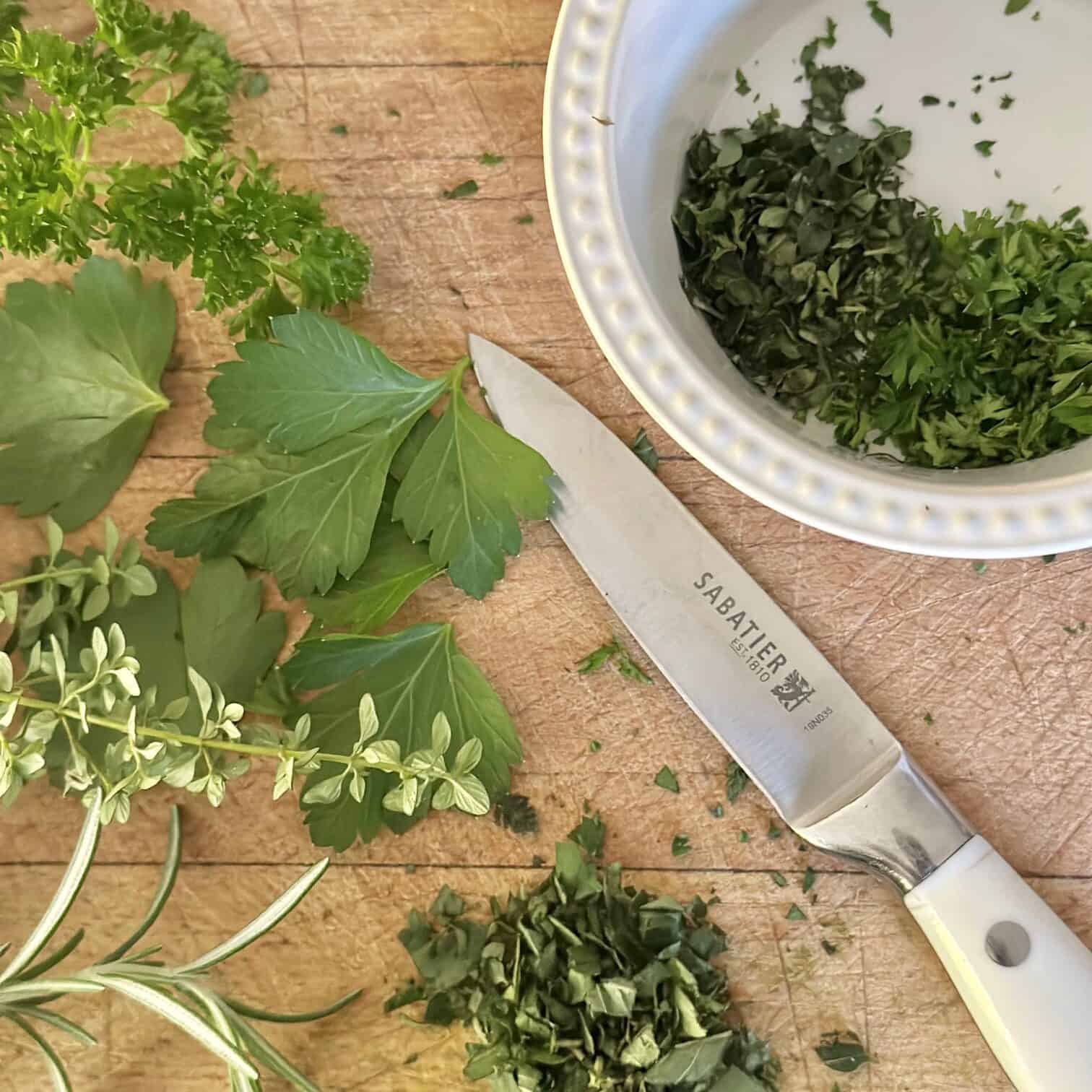 Chopping mixed herbs. 