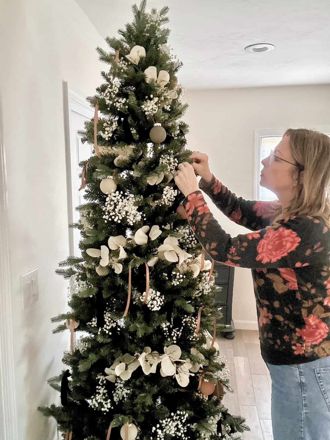 Me decorating the Christmas tree featured in this post. 