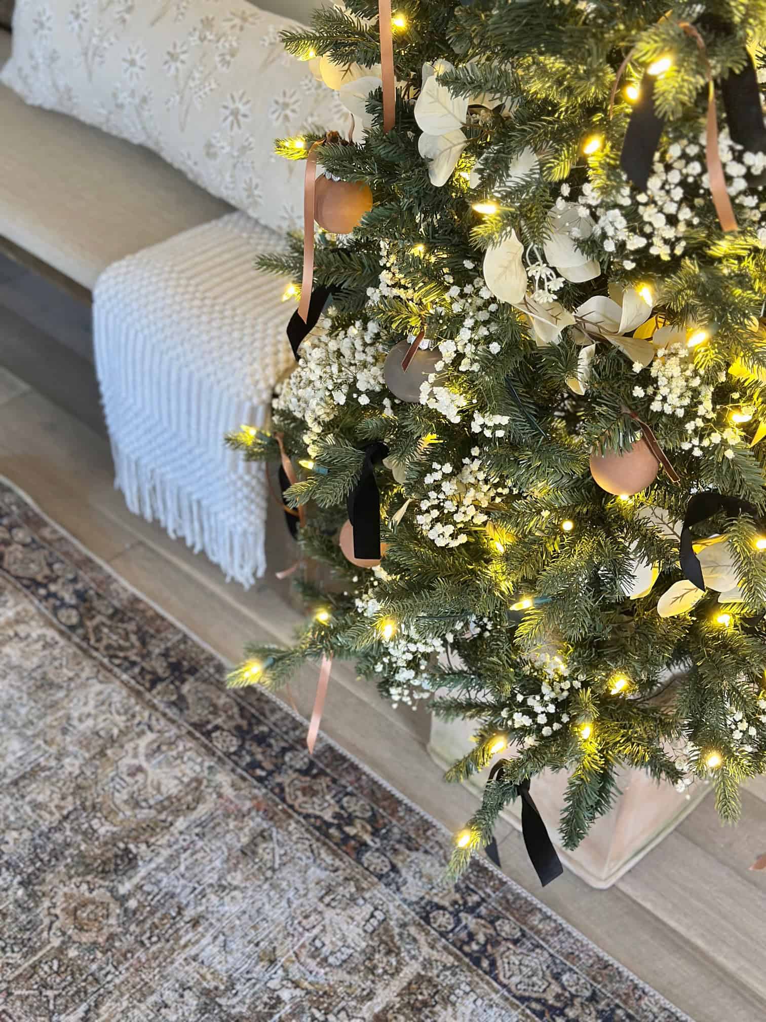 A view from top down at a Christmas tree in a clay pot. 
