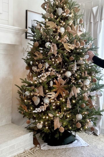 How long to leave Christmas decorations up. Me un-decorating our Christmas tree.