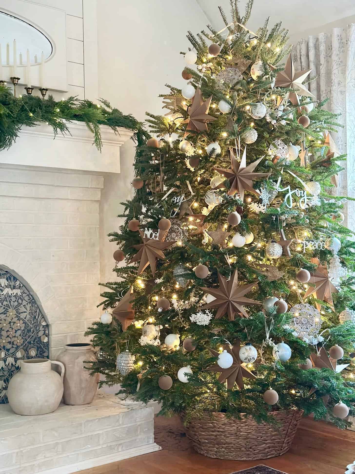 Our 2025 tree with big stars and lots of ornaments.