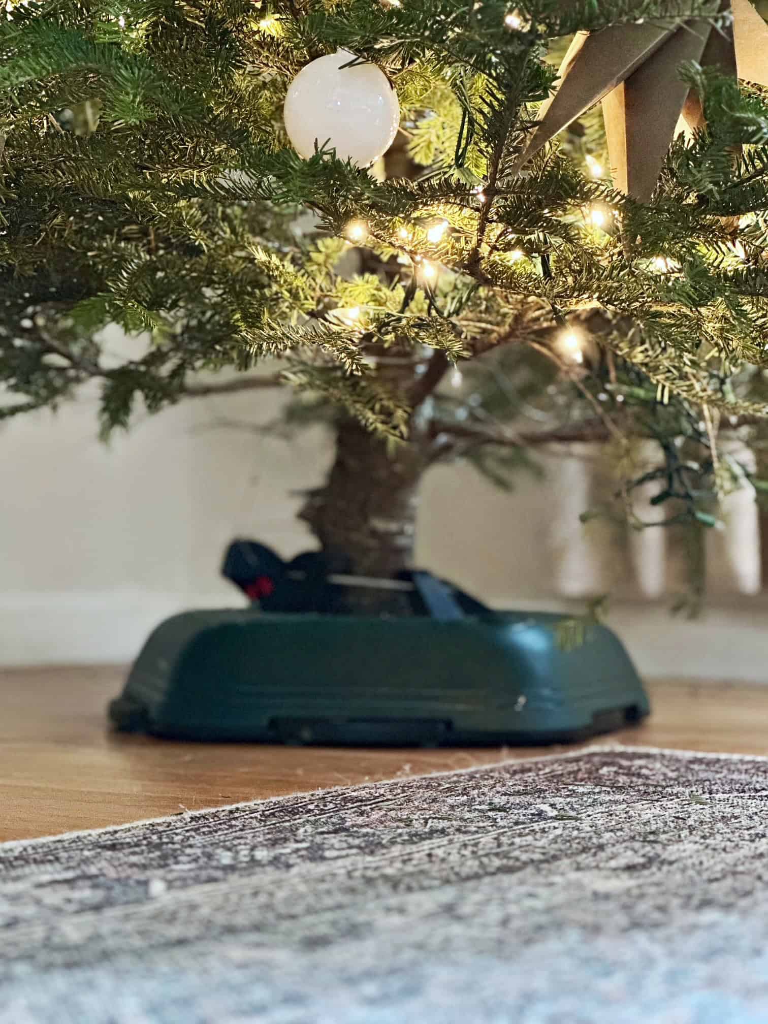 Christmas tree stand without anything covering it. 