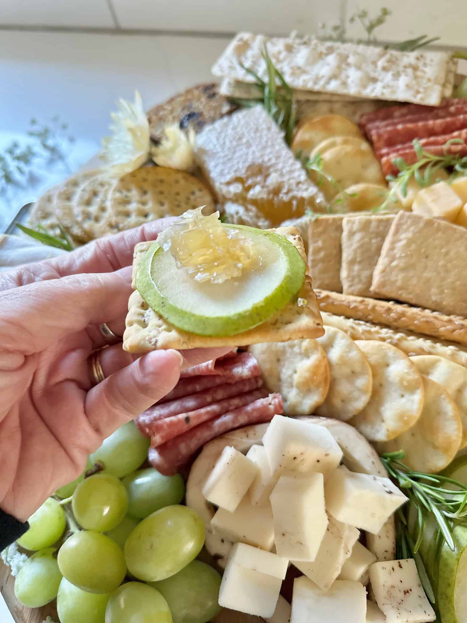 Cracker, pear slice and honeycomb.