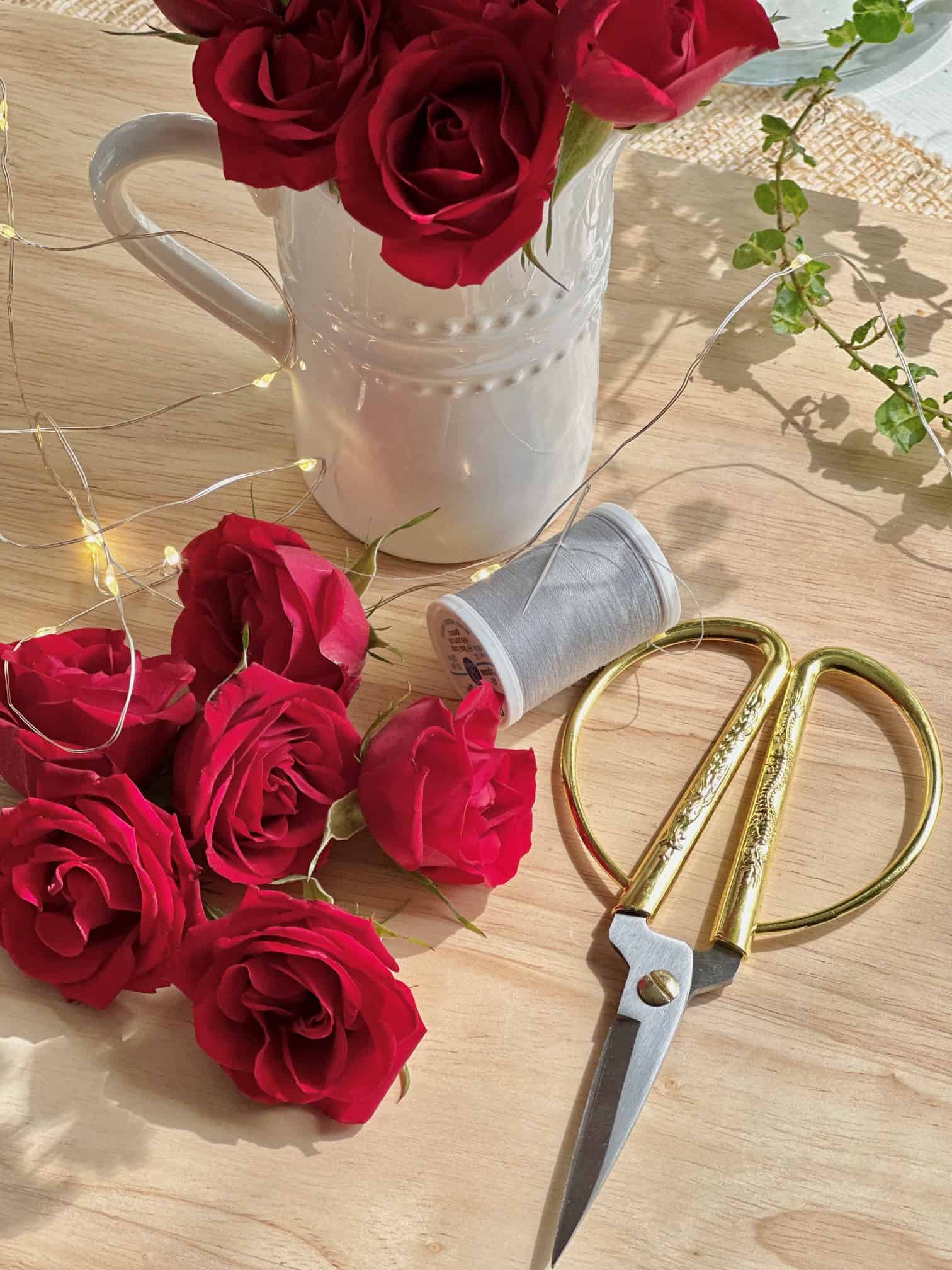 Supplies to make rose garland.