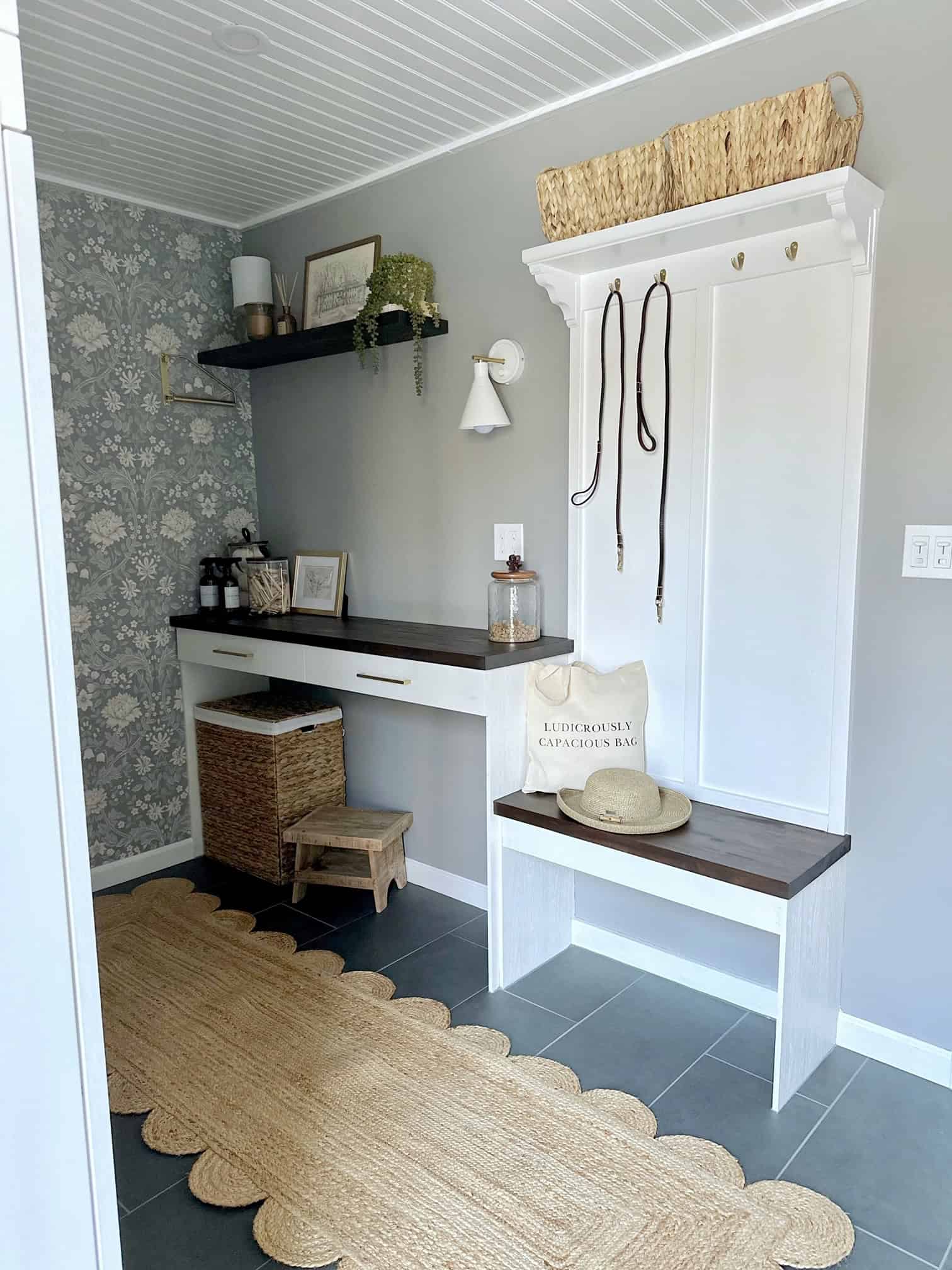 Our simple dog walking station. its a low small bench with panel on top and an upper shelf holding baskets for supplies. 