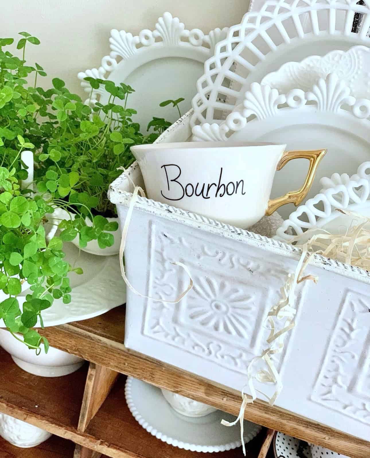 Bourbon tea cup with shamrocks nearby. 