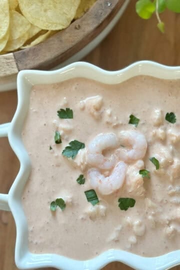 Shrimp cocktail dip made with sour cream, cocktail sauce and shrimp.