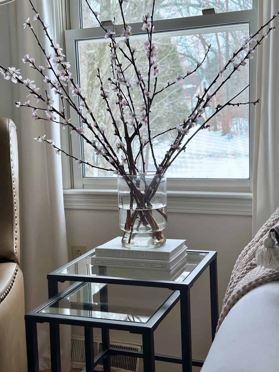 Branches in bloom in a vase of water. 
