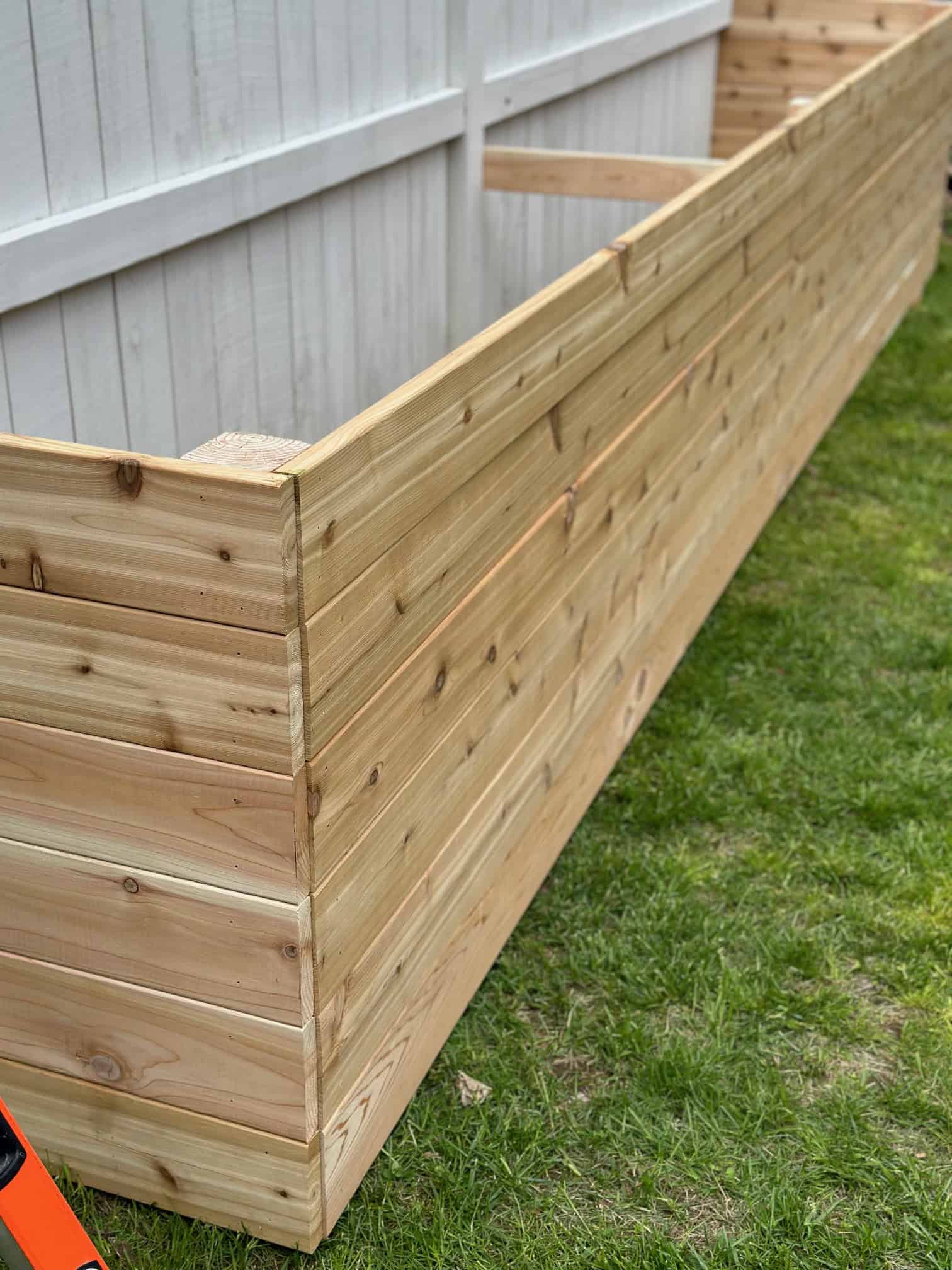 The herb raised garden bed is built with cedar.