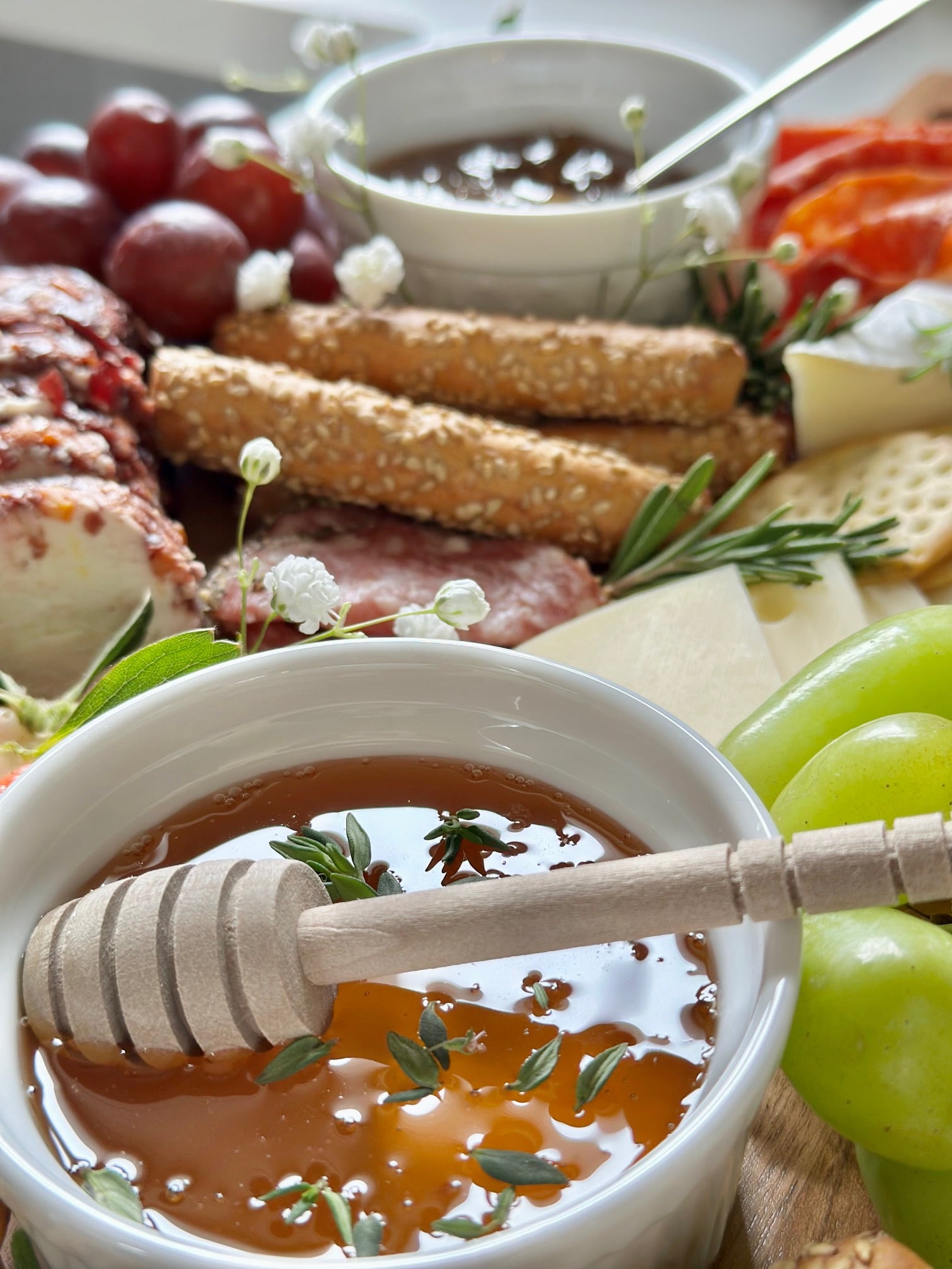 2 small bowls filled on a charcuterie board. 