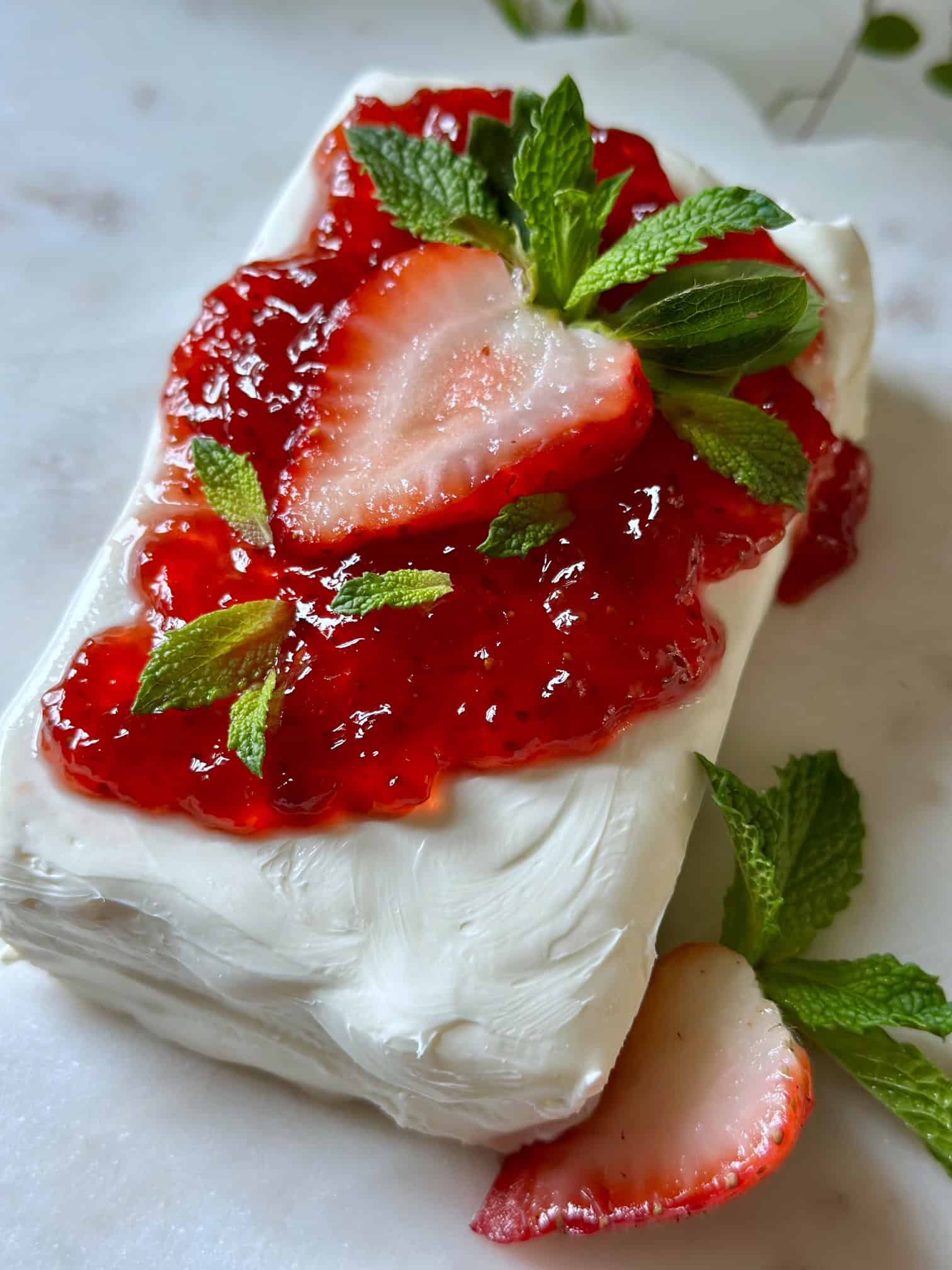 Cream cheese with strawberry jam and mint. 
