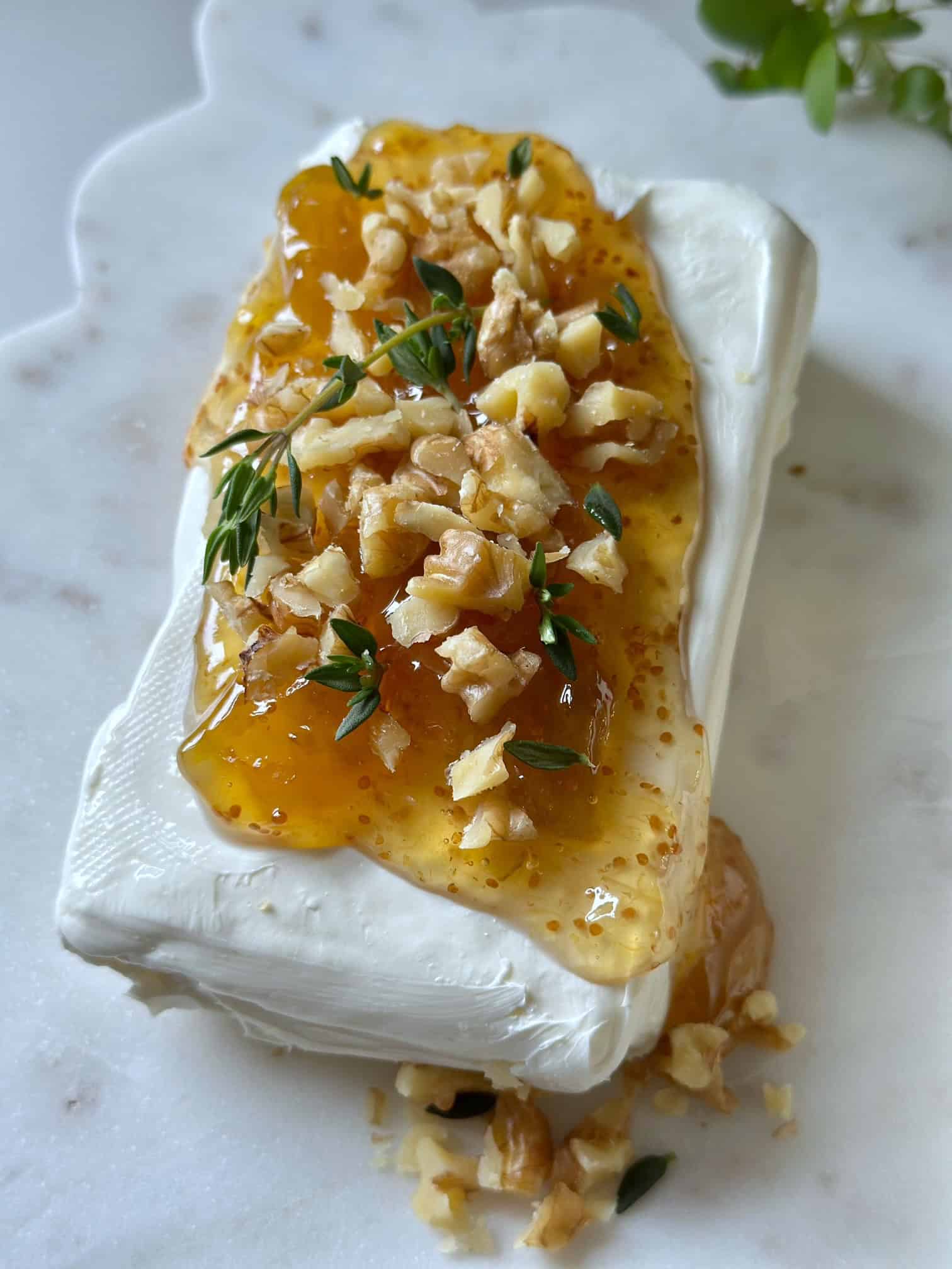 Cream cheese with fig jam, chopped walnuts and thyme. 