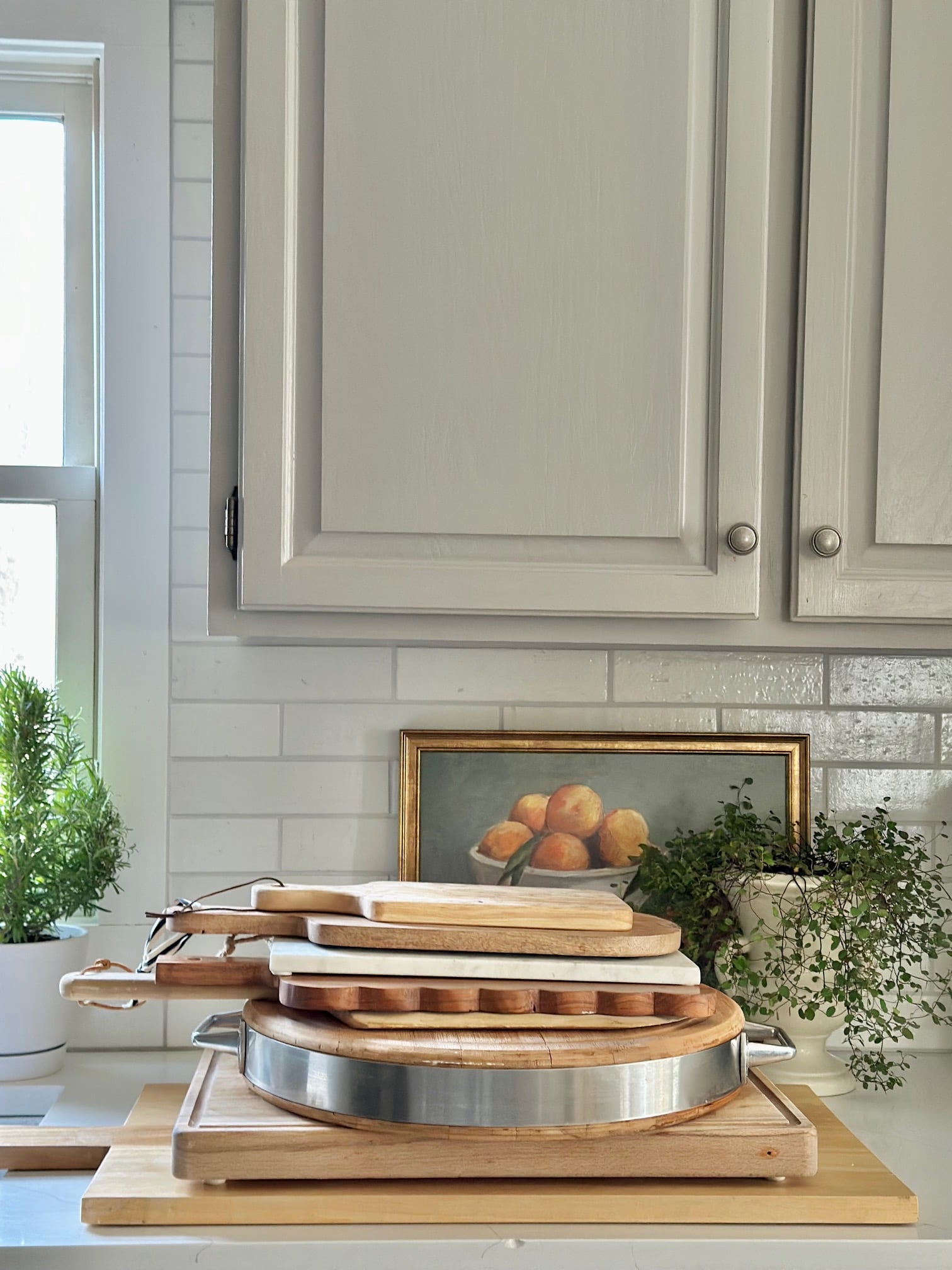 Boards for charcuterie stacked on a counter. 