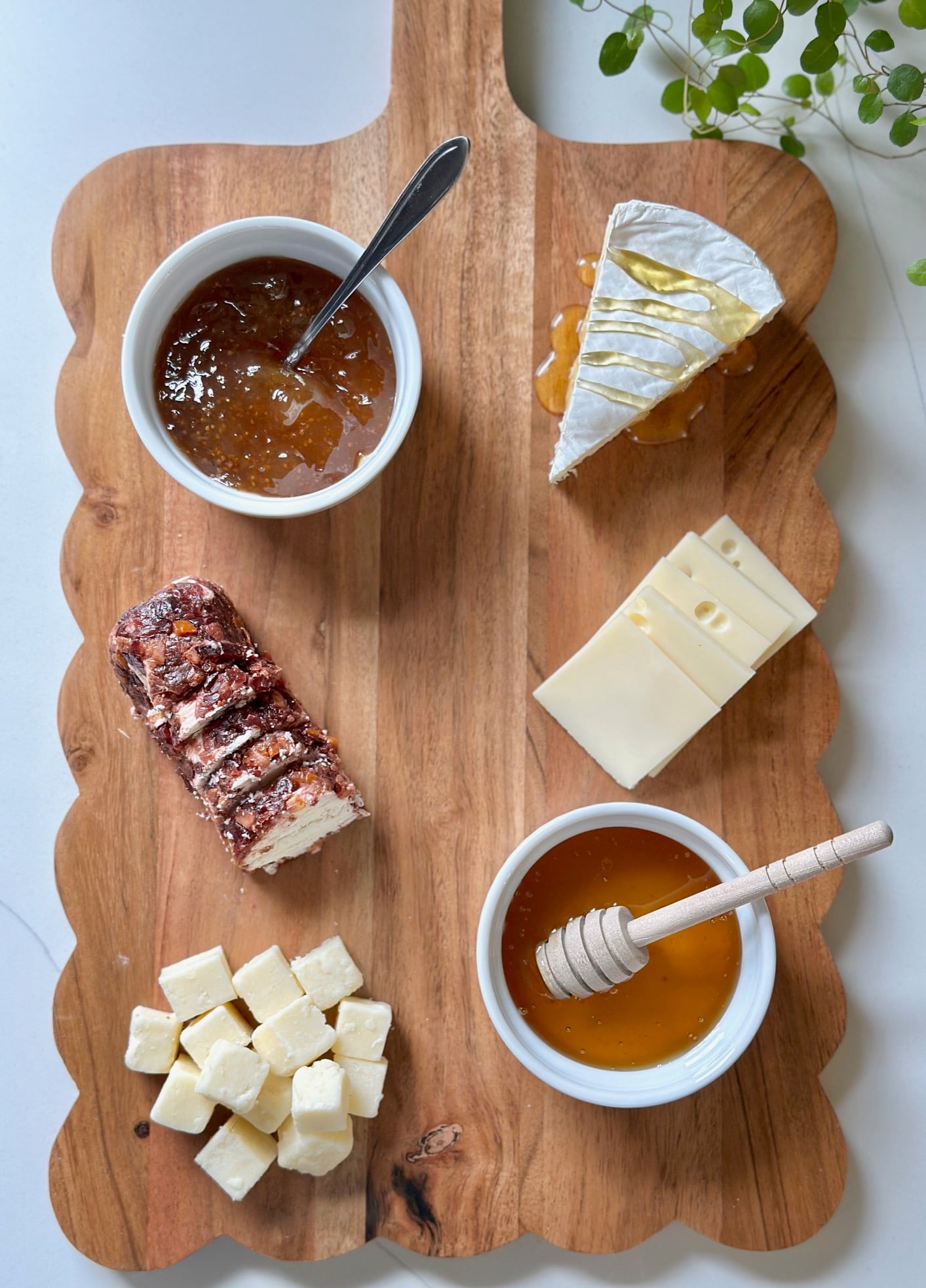 Cheese added to the charcuterie board.