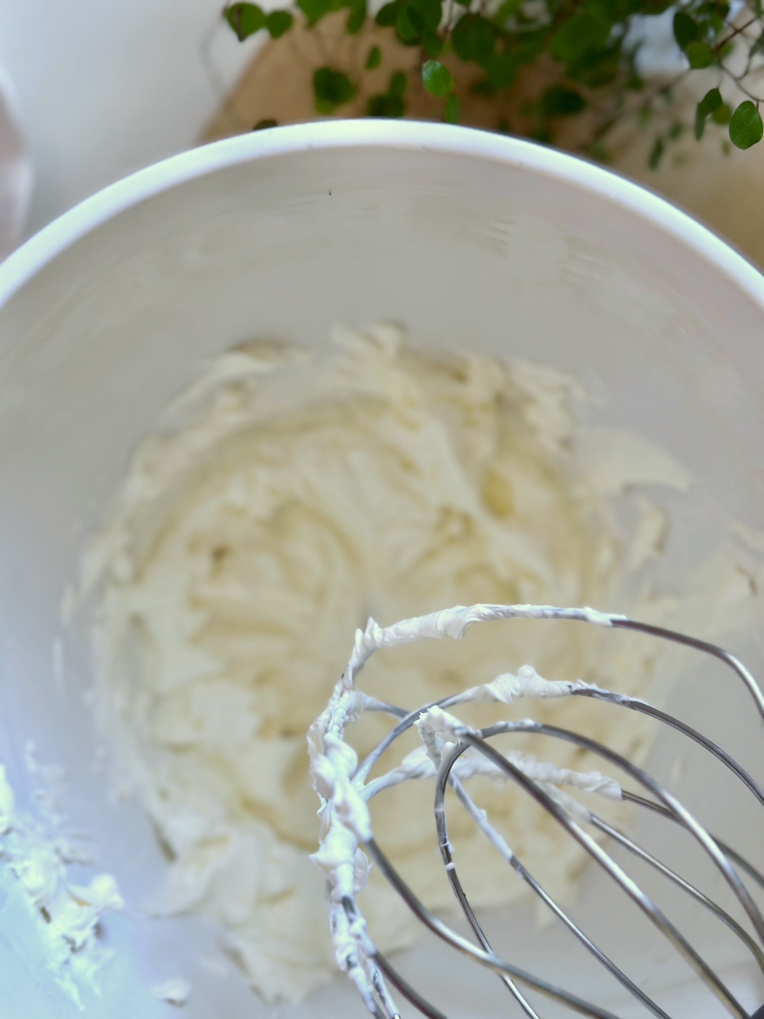 Beating the creme fraiche and the cream cheese together. 