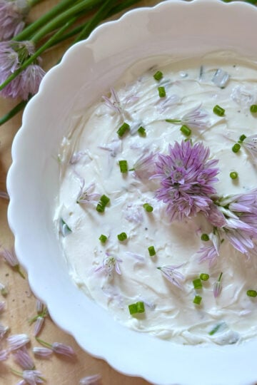 Fresh chive dip featuring chive flowers.