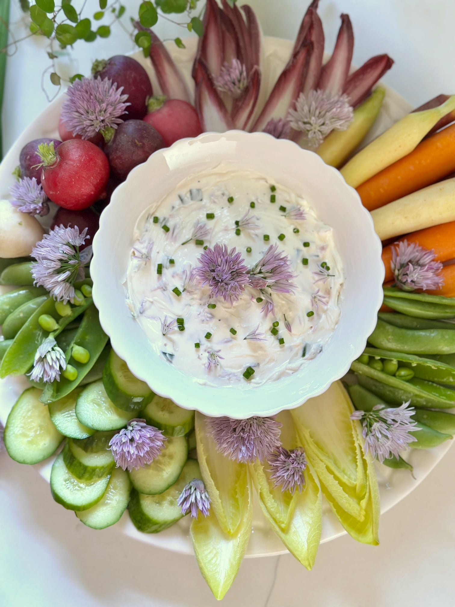 Chive dip on a vegetable crudités tray. 