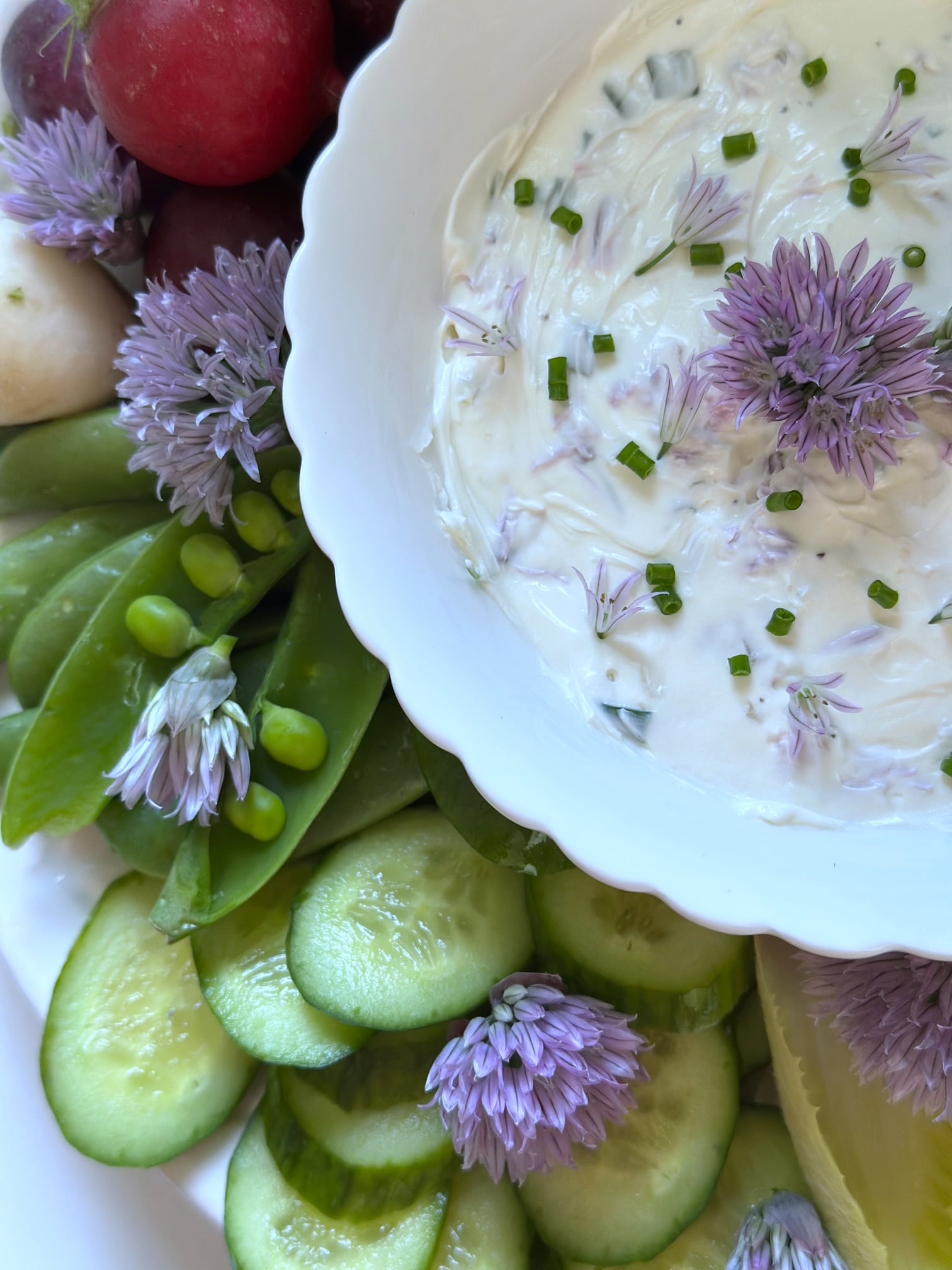 Chive dip with vegetables on a tray. 