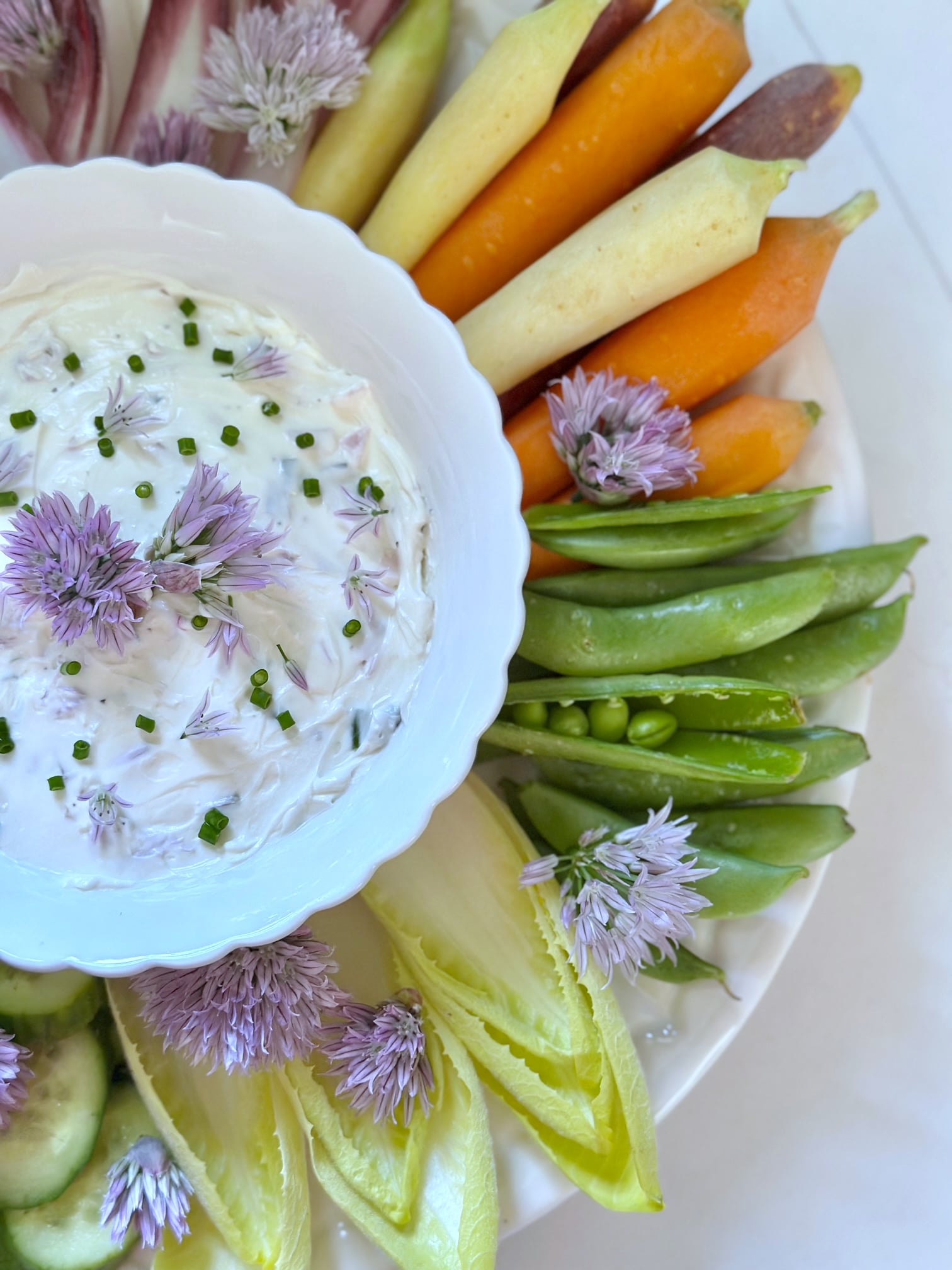 Chive dip served with fresh vegetables. 