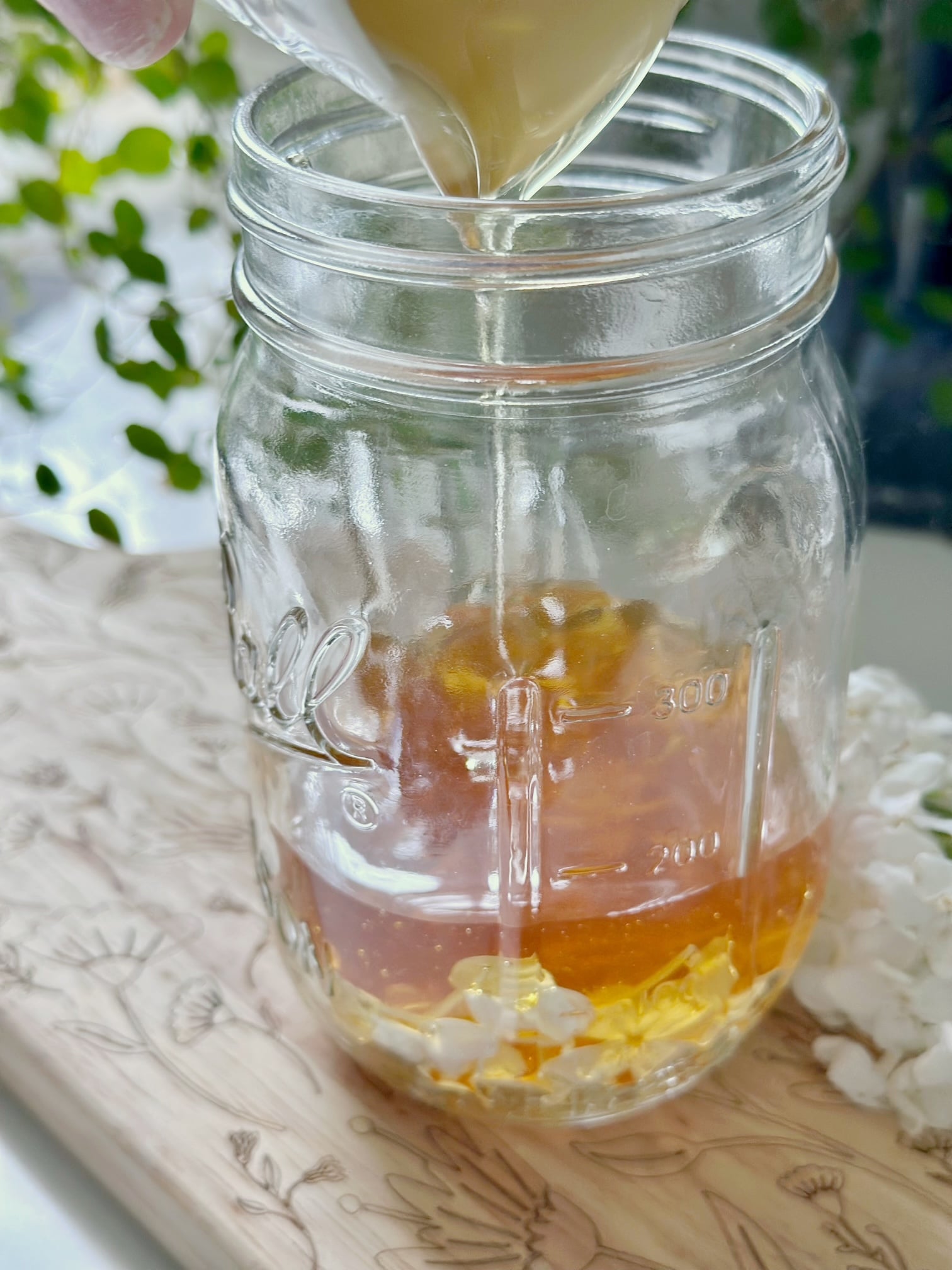 Pour honey over lilac blooms.