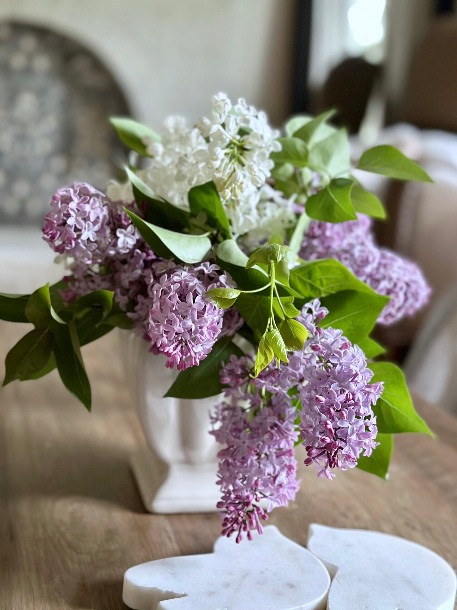 Vase of lilacs in a compote. 