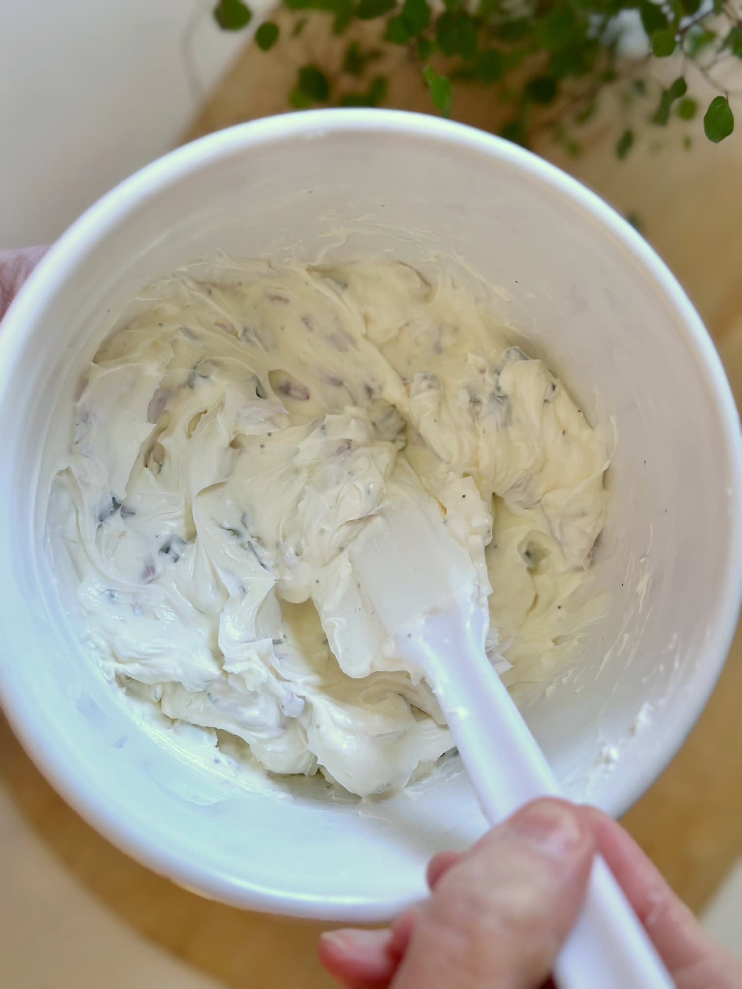 Stirring dip that has been chilled. 