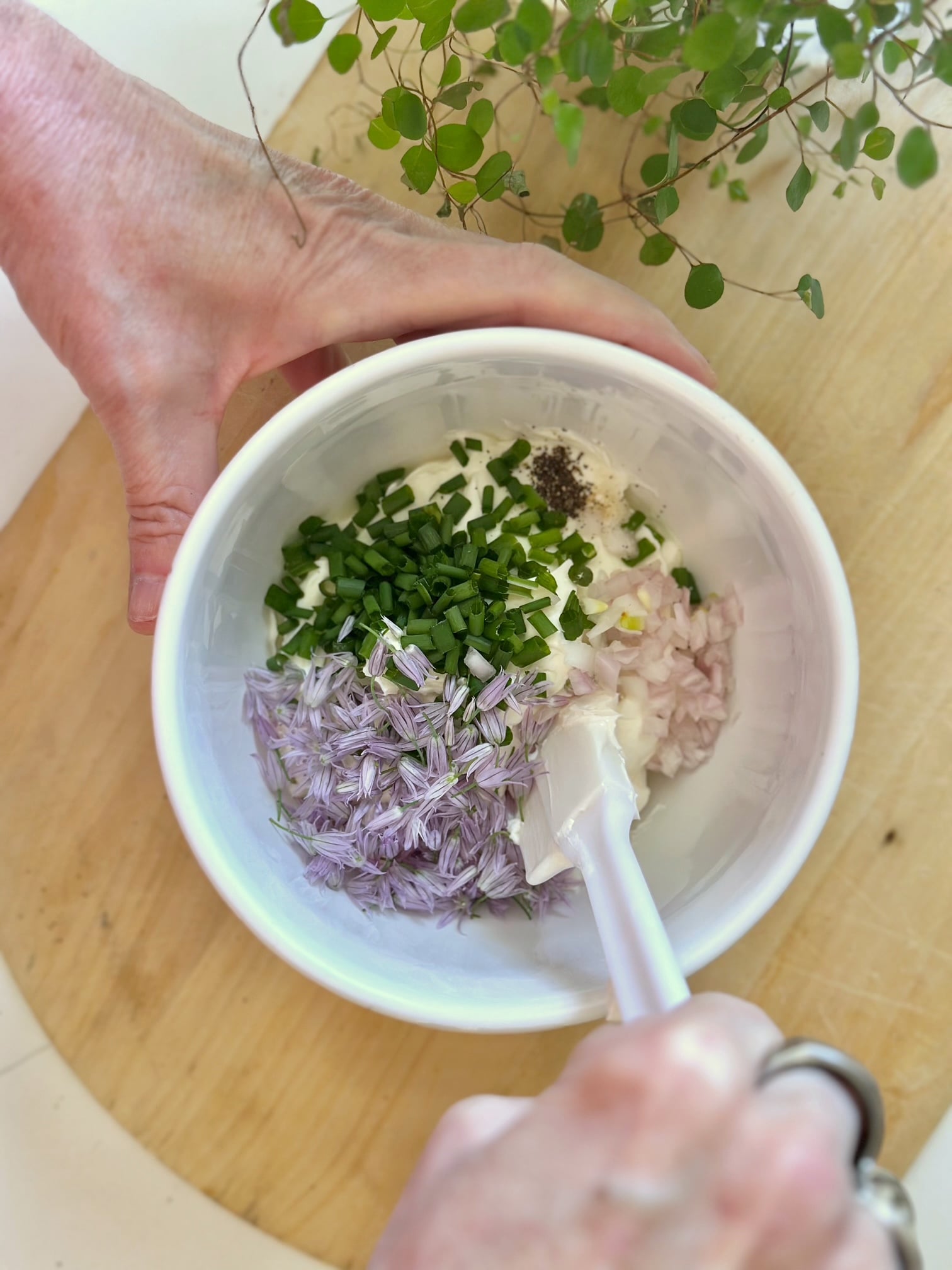 Mixing the remaining ingredients into the dip base. 