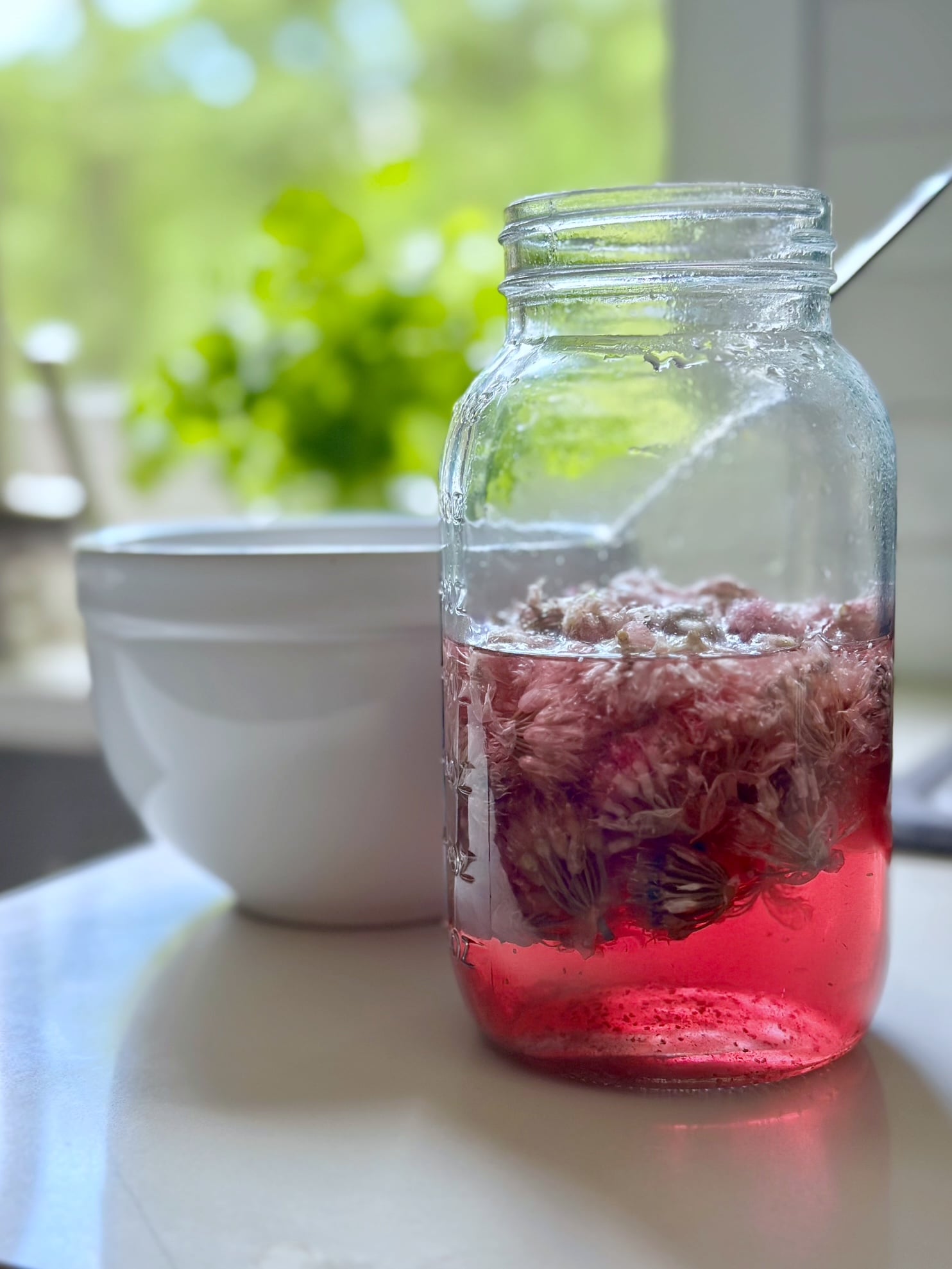 Chive blossoms in a jar with vinegar. 
