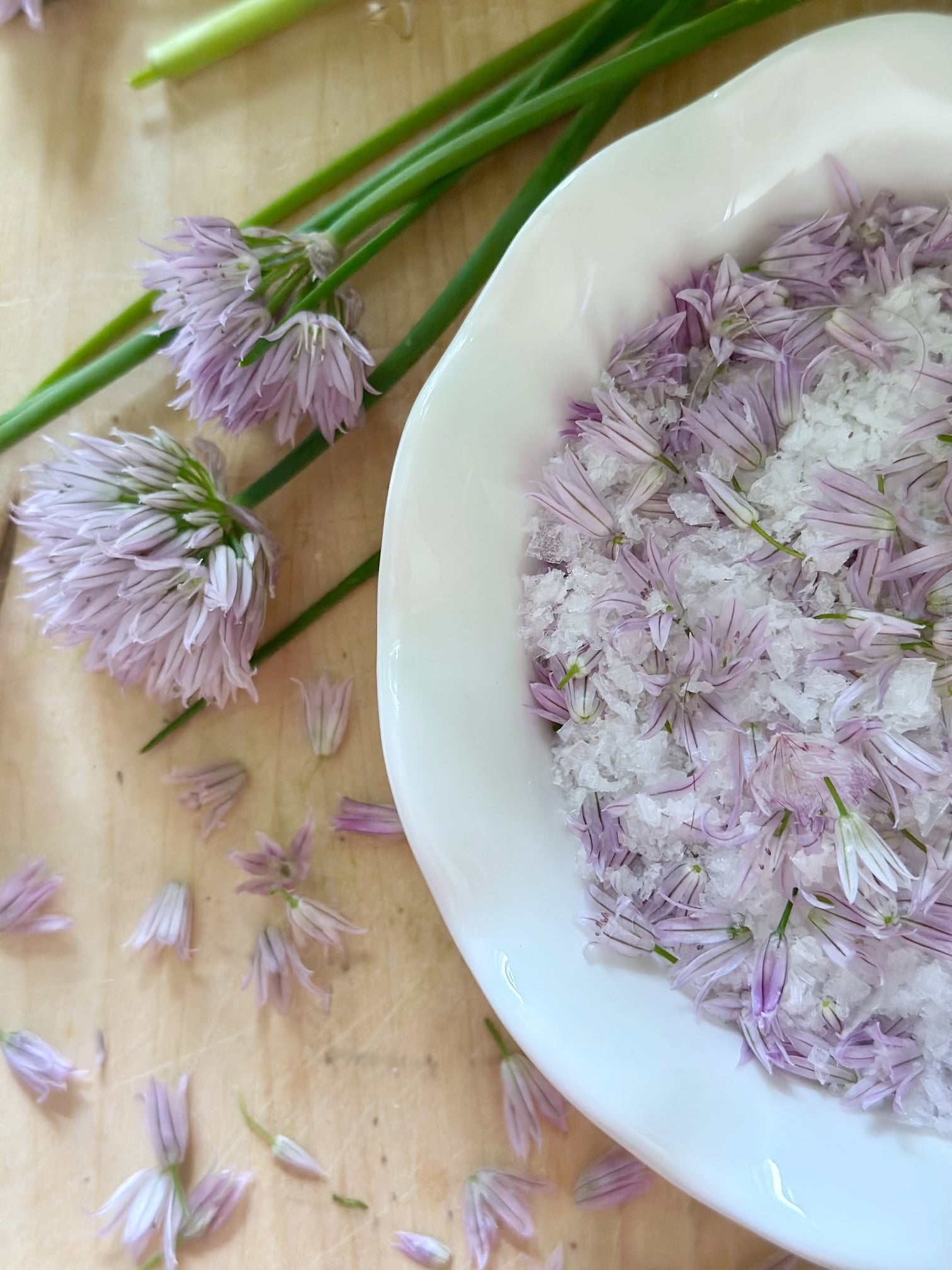 Chive flower salt dried in a bowl.