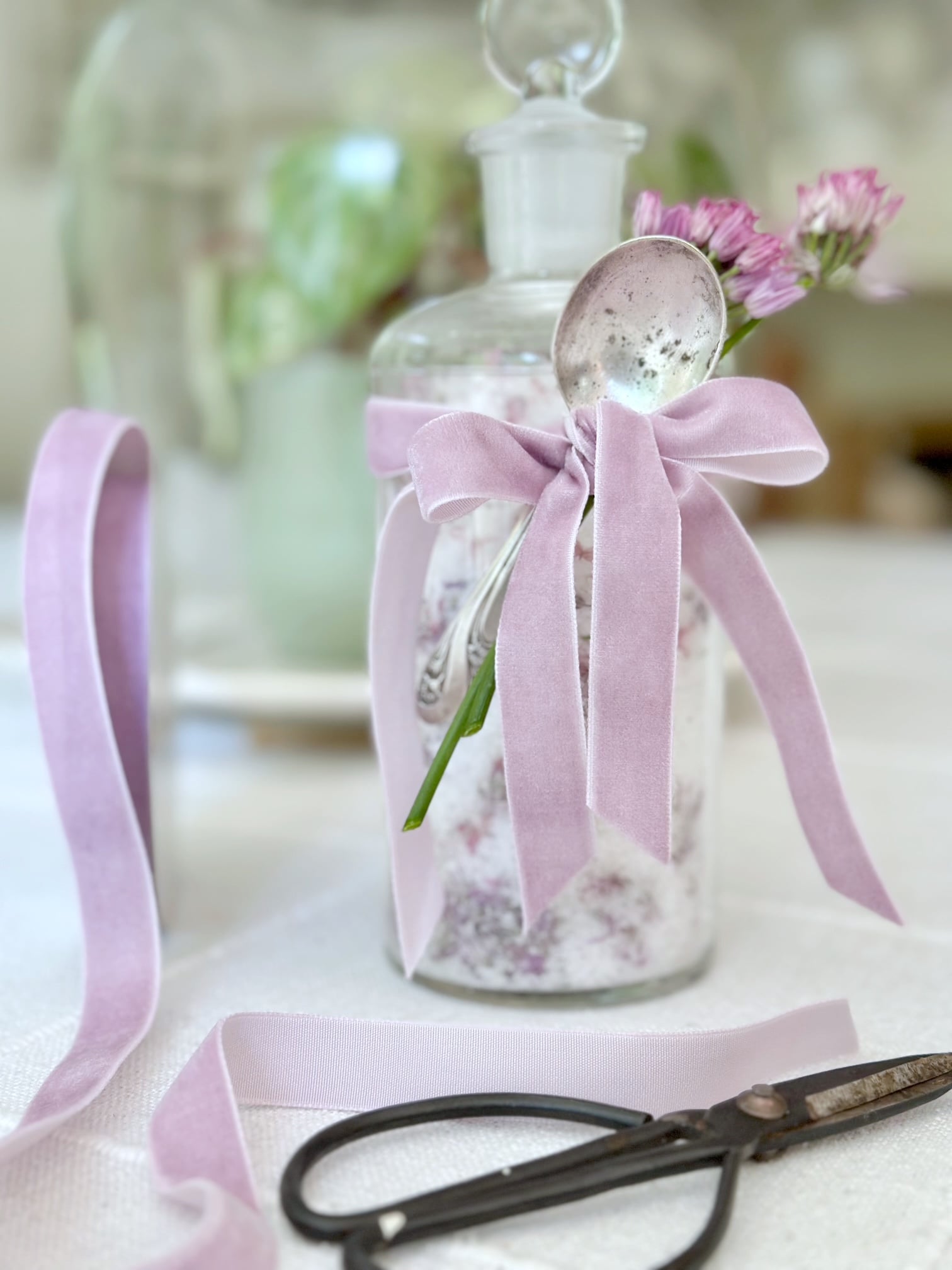 Gift of chive flower salt in a glass jar.