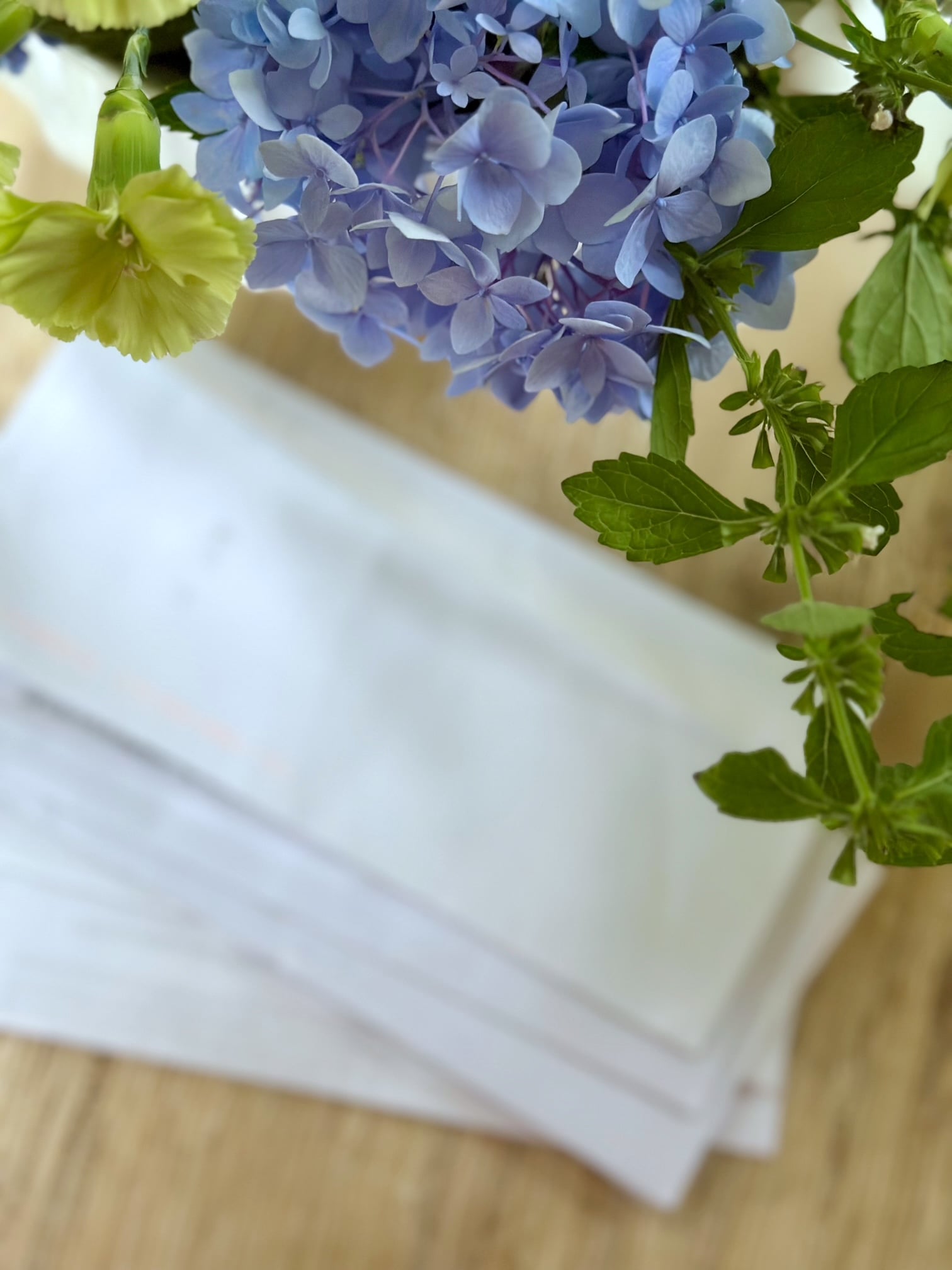 Decluttering Mail - mail strewn on a counter top.