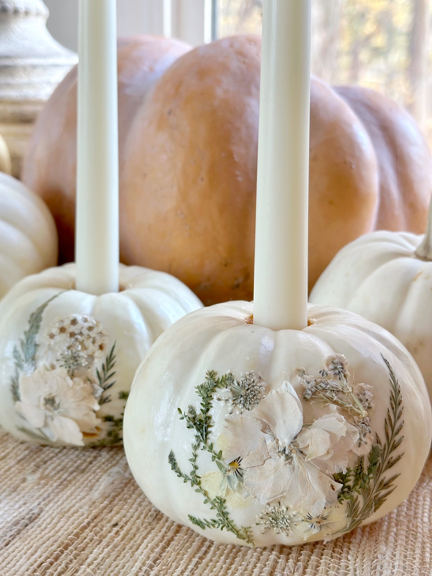 Pressed flower pumpkins with candles. 
