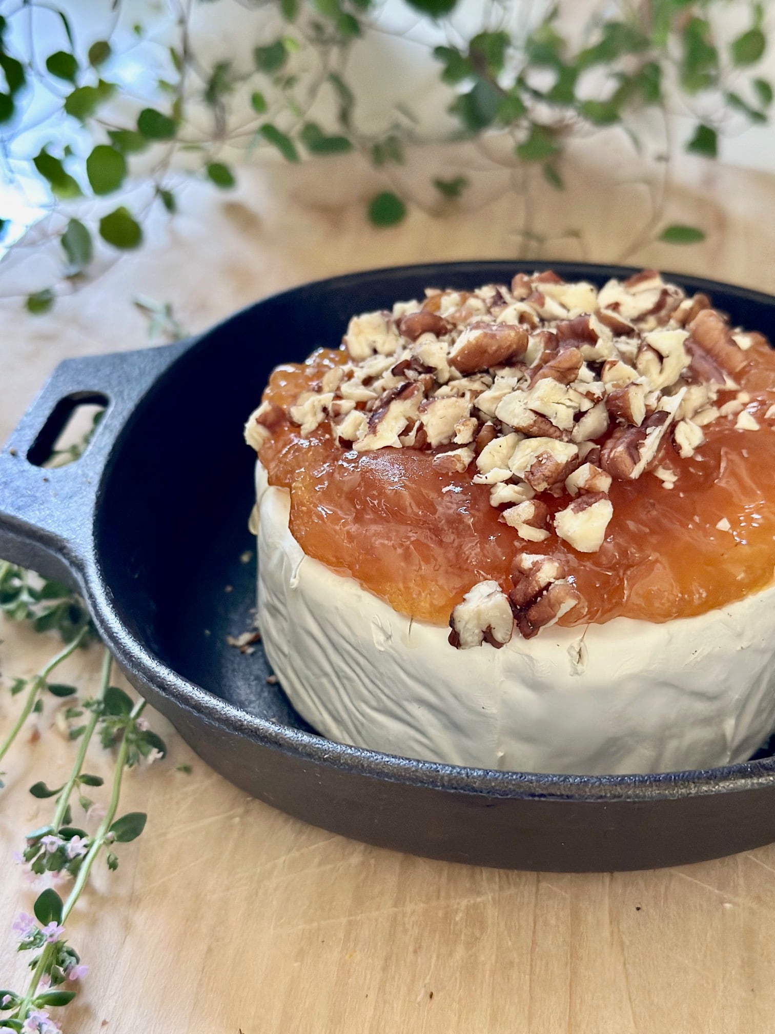 Chopped pecans on top of preserves. 