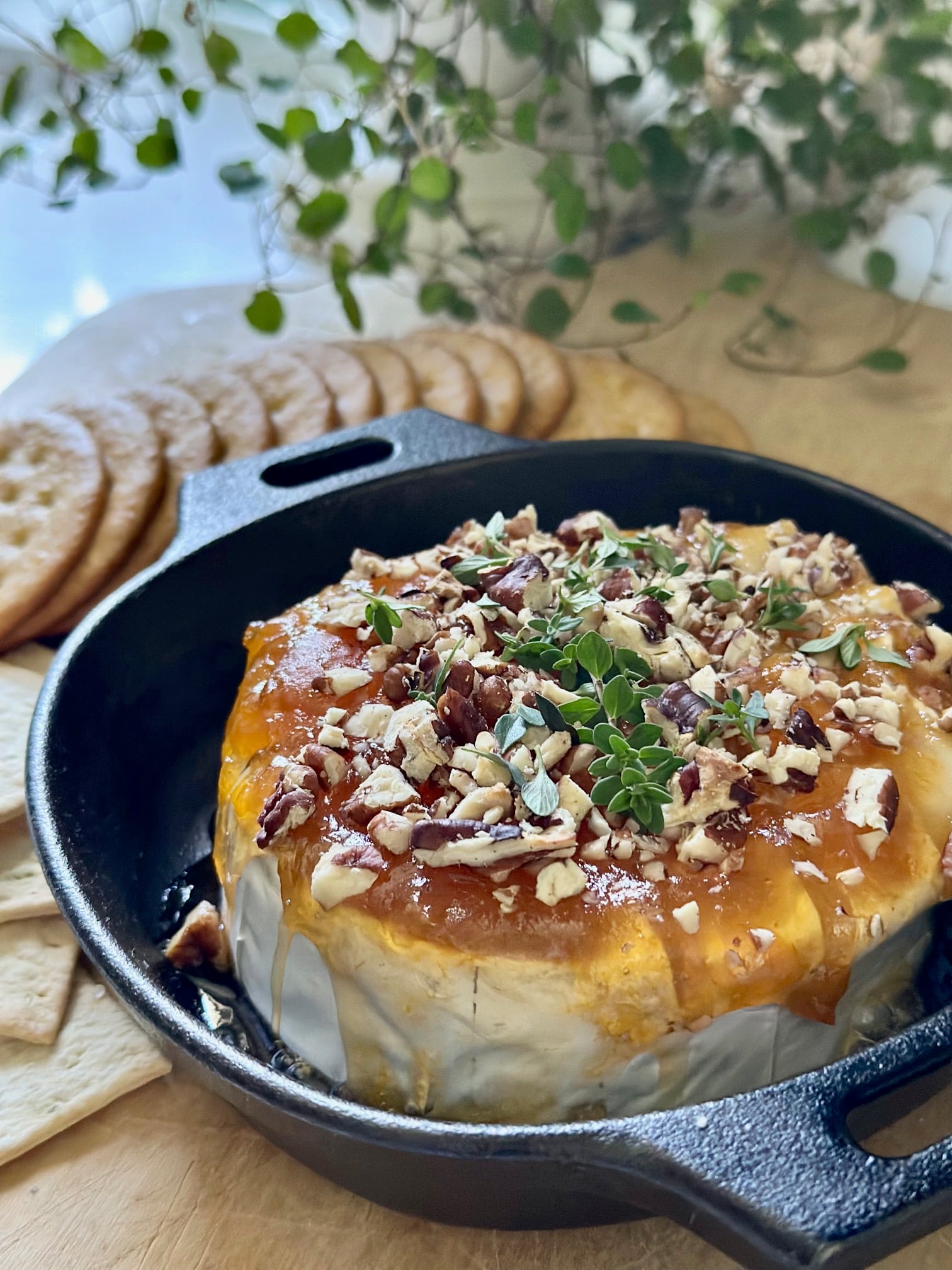 A small cast iron baked brie with apricot preserves. 