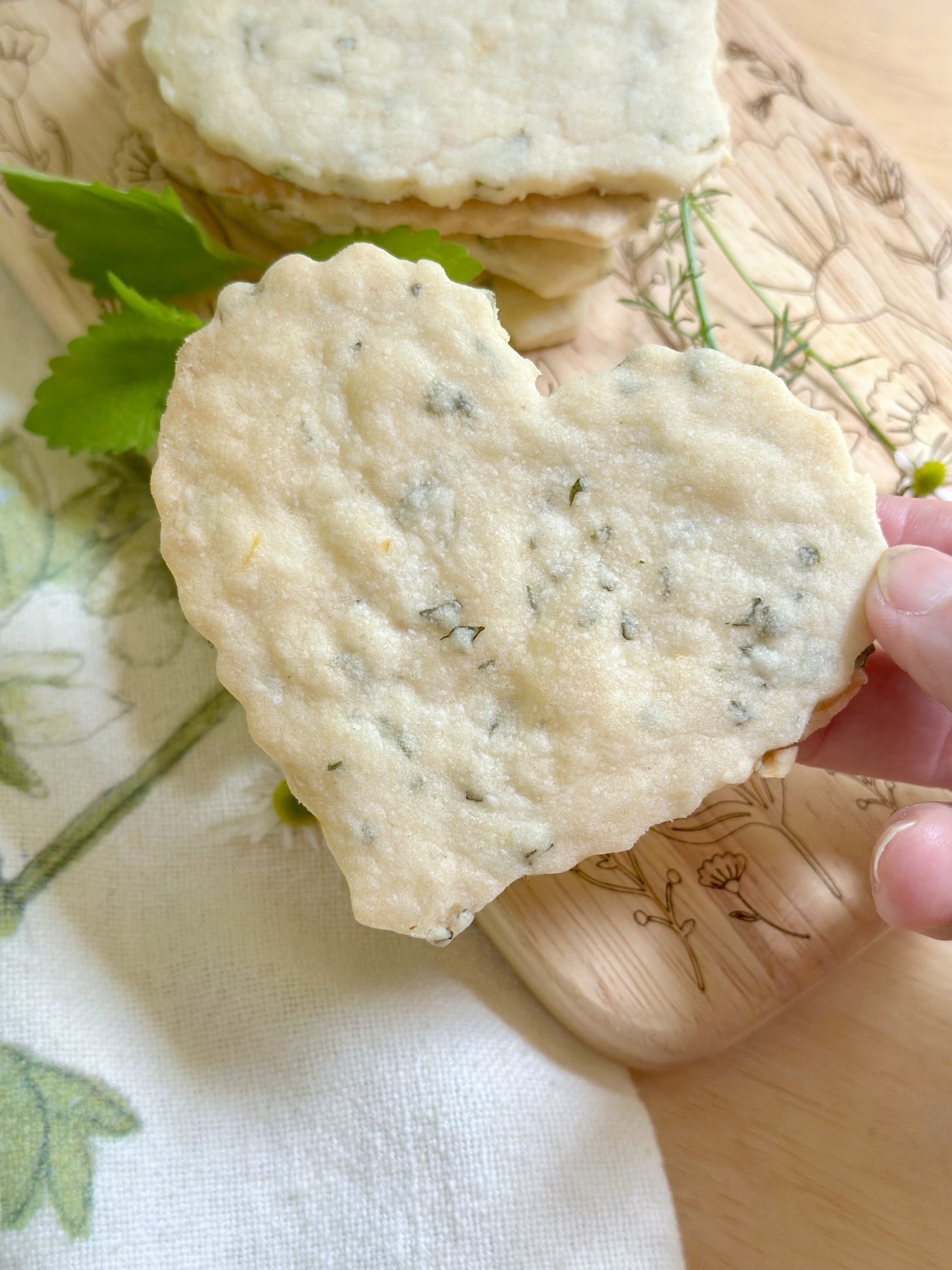 A lemon balm cookie shaped in a heart.