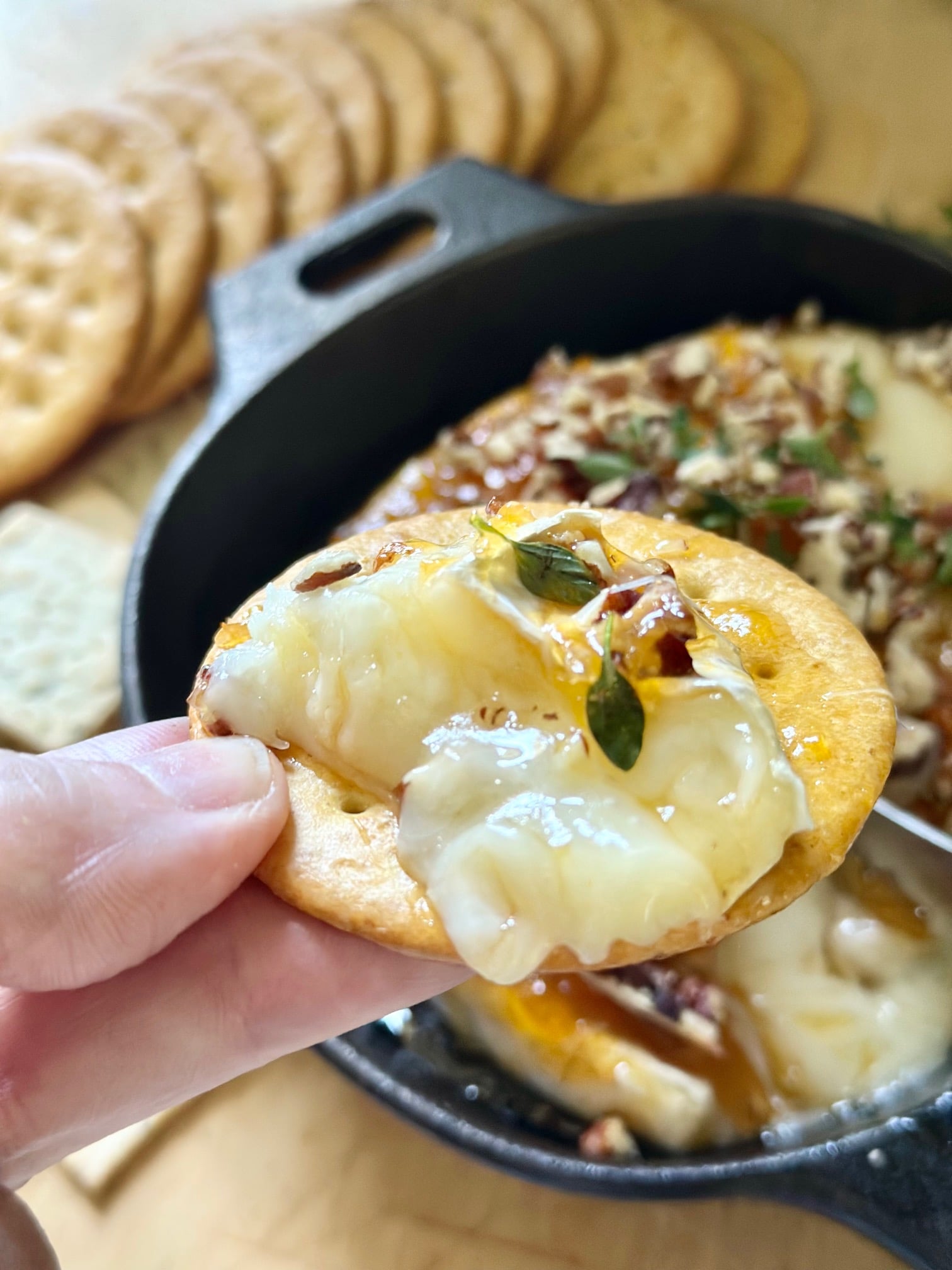 Scooped baked brie with preserves. 