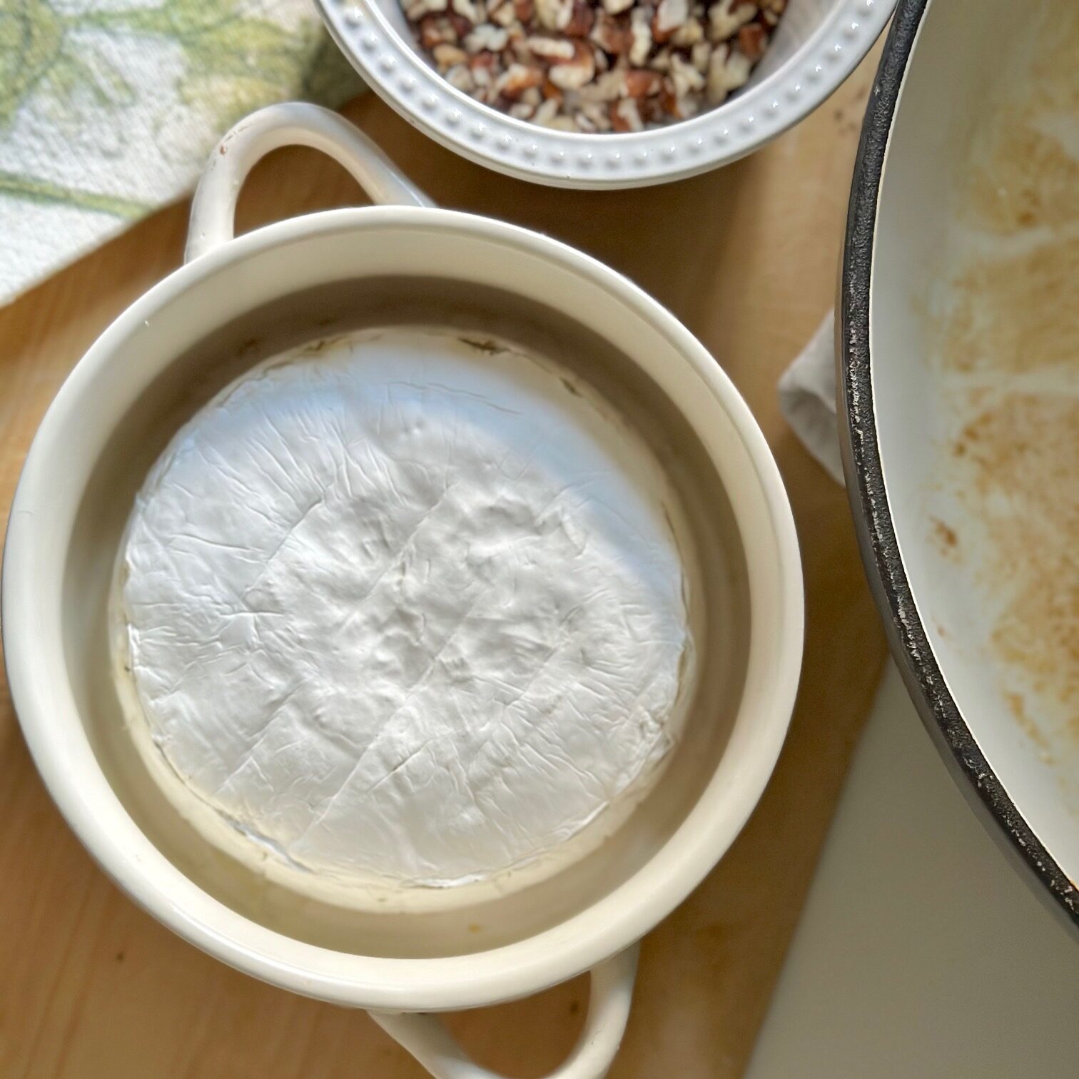 Brie wheel in a brie baking dish all baked.