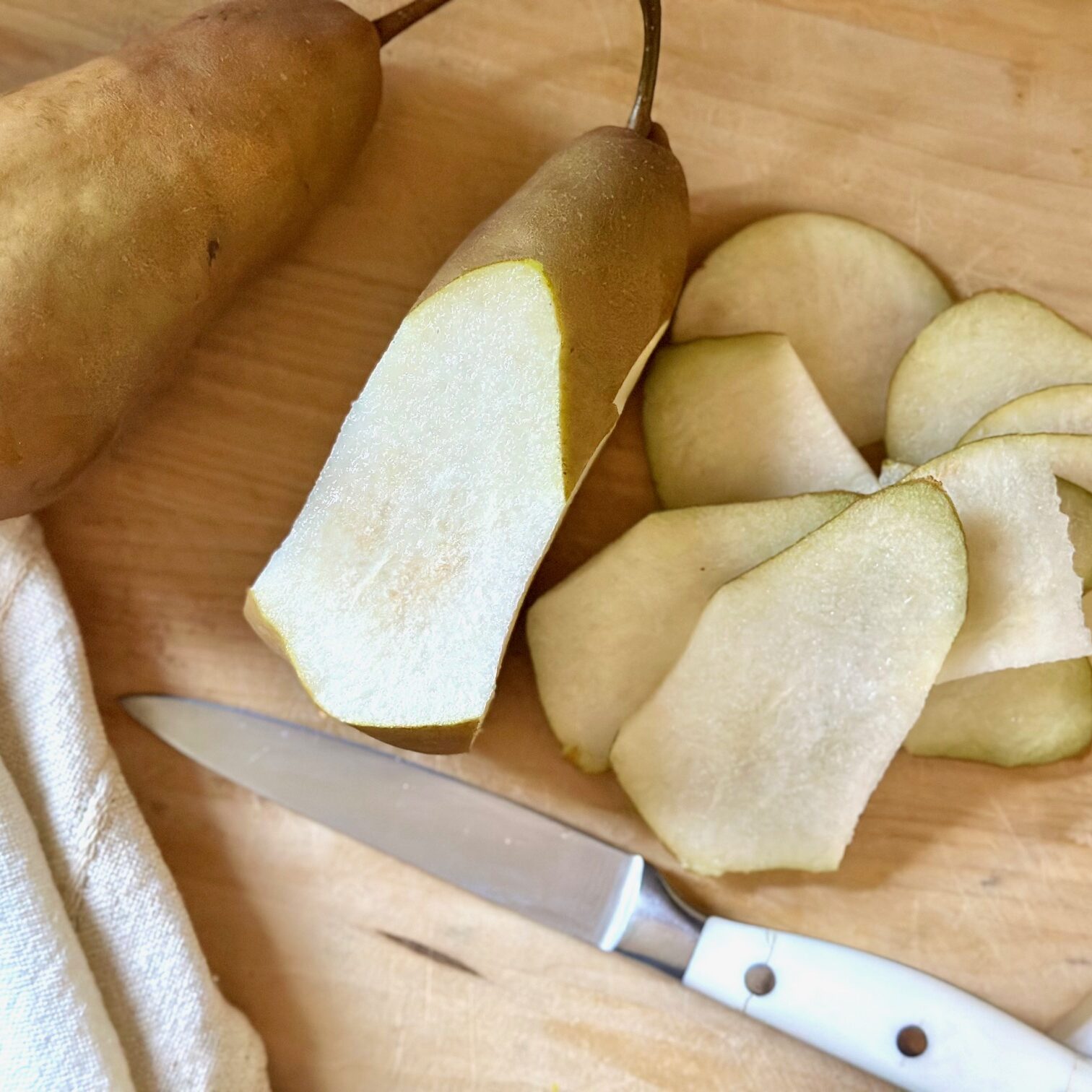 Slicing a Bosc pear.